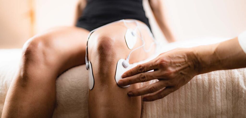 https://painconsultants.com/wp-content/uploads/2016/02/knee-physical-therapy-with-tens-electrode-pads-tr-2021-08-26-16-54-03-utc-1024x492.jpg